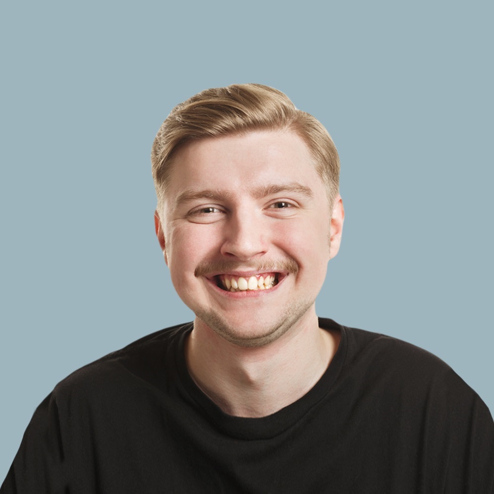 Friendly realtor with neat blonde hair, smiling against blue backdrop for We Are Buyers Agents home buying services.
