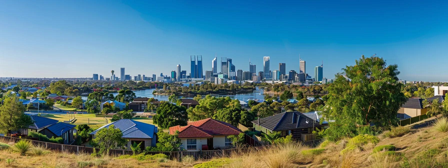 Panoramic view of Perth's skyline with residential homes and greenery in the foreground, illustrating the metropolitan landscape relevant to property buying costs in Western Australia.