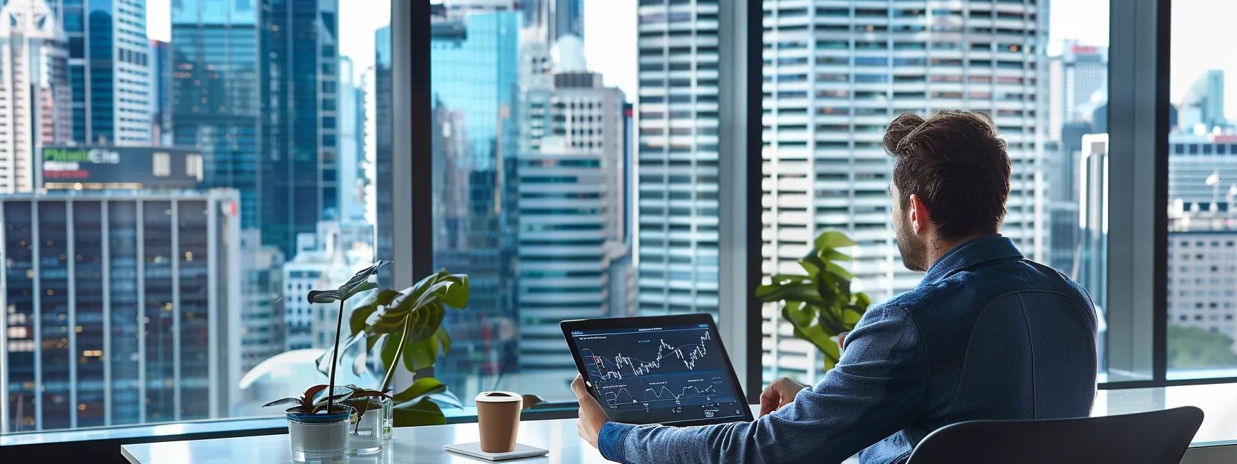 Man viewing property market data on a laptop in a modern office with a city skyline backdrop, symbolizing buyer's agent services and market insights in Sydney.